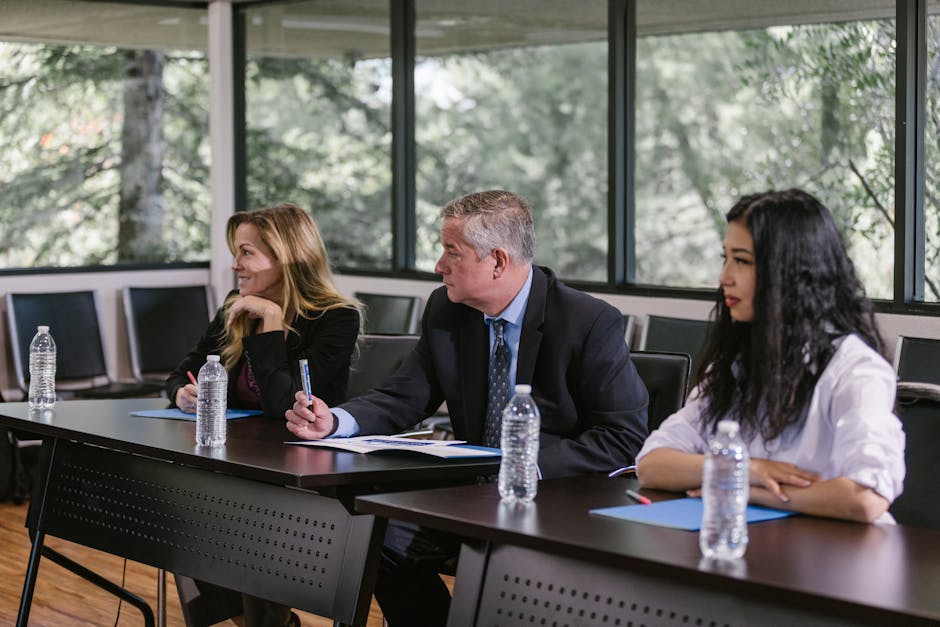 Diverse professionals engaged in a business meeting in a modern conference room