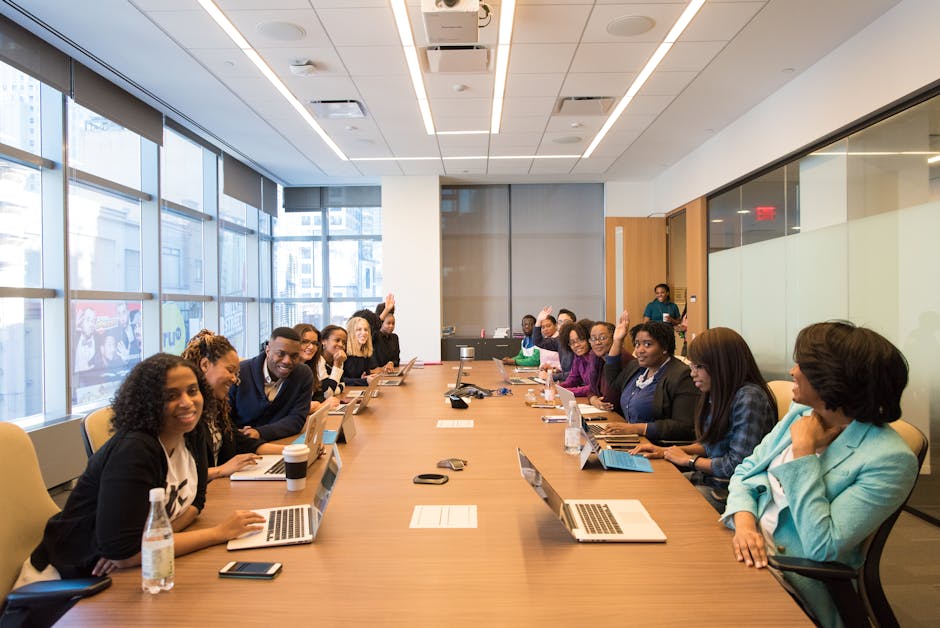 A diverse group of professionals engaging in a productive meeting around a conference table